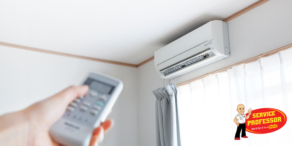 Homeowner turning on a ductless mini-split with a remote.