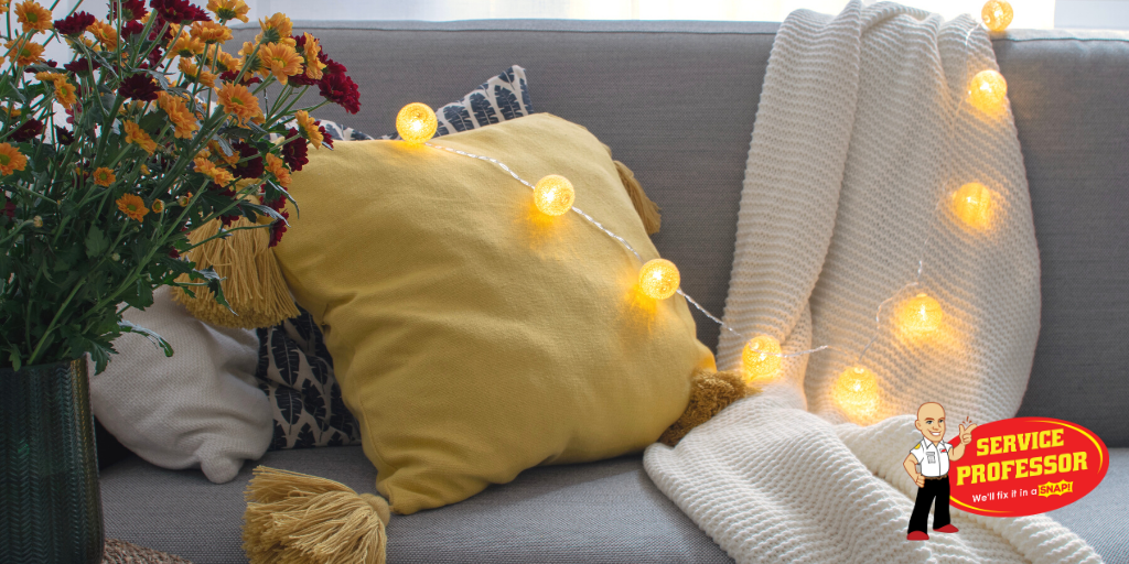 string lights on a couch with pillows