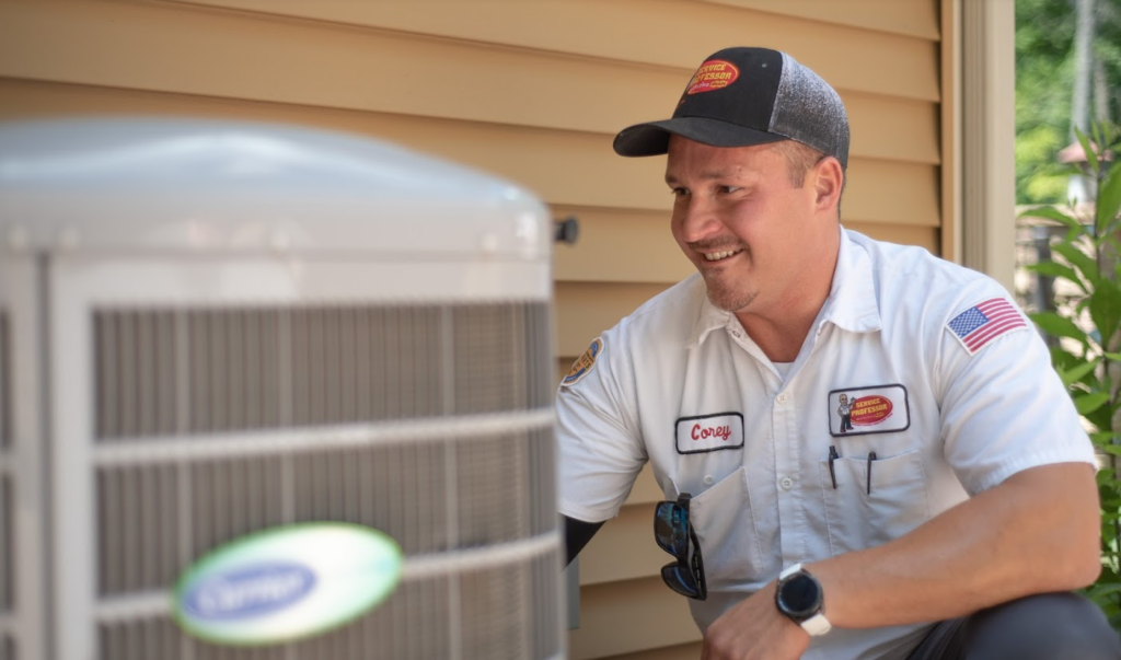AC technician servicing an air conditioner outdoor unit